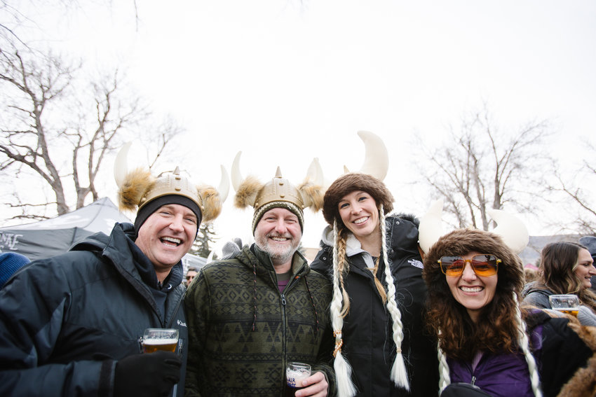 Tim Trimbur, Jason Trimbur, Katie Vatterrodt and Joey Schildt smile in their Viking hats during UllrGrass Saturday.